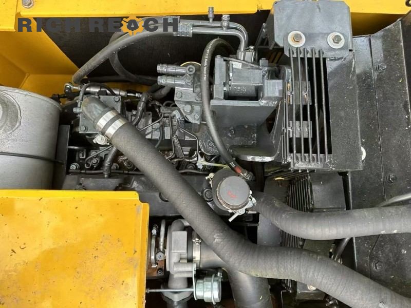 Overall undercarriage view of a 2023 Komatsu PC130-8 excavator with 500 hours, priced at $16,667